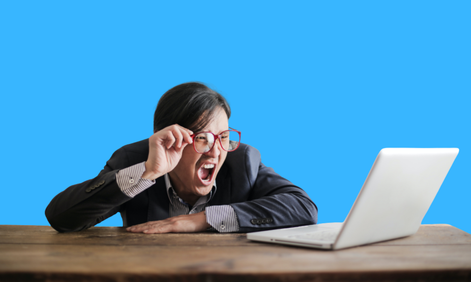 Angry person yelling at their laptop