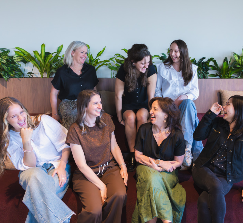 Coloured photo of the team at RM laughing