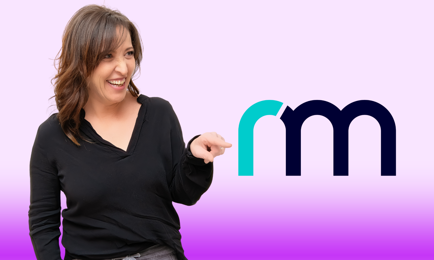 Vikki pointing at the new RM logo