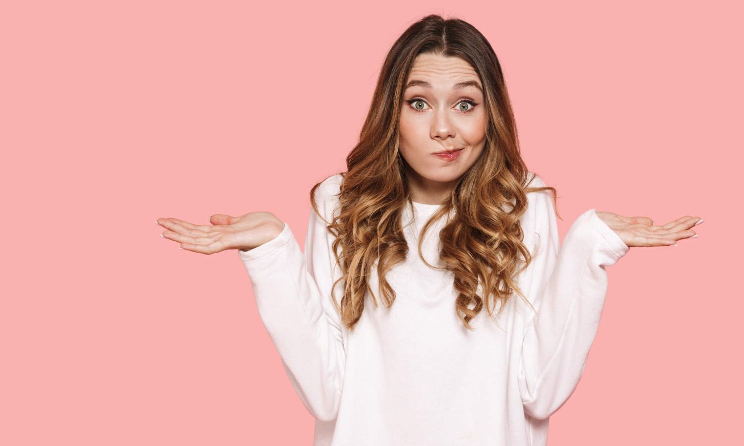 Woman shrugging and looking confused